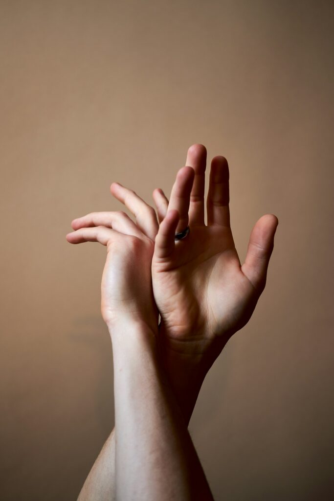 Two people communicating in American Sign Language