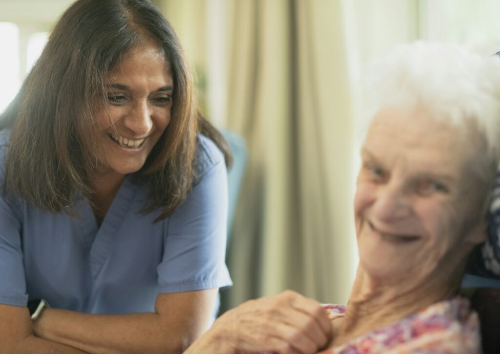 A nurse cares for an elderly patient