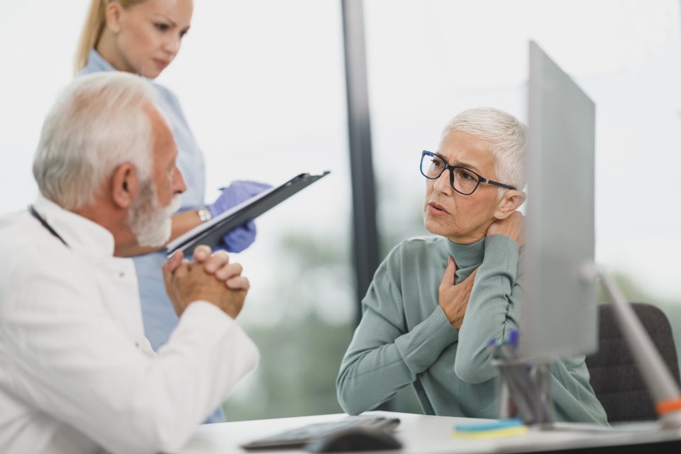 Clinician interviewing a patient during a cognitive debriefing session
