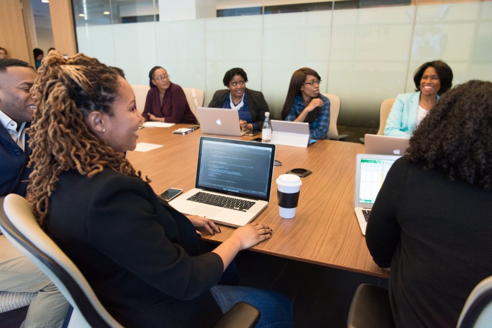 Diverse public agency team planning language access services around a conference table