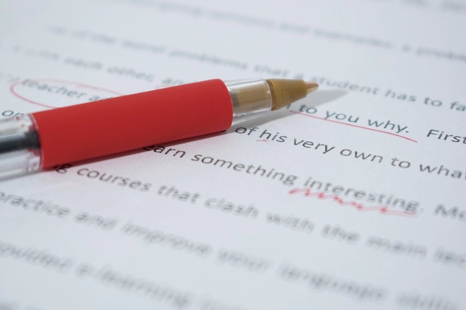 Red pen corrections on a printed translation